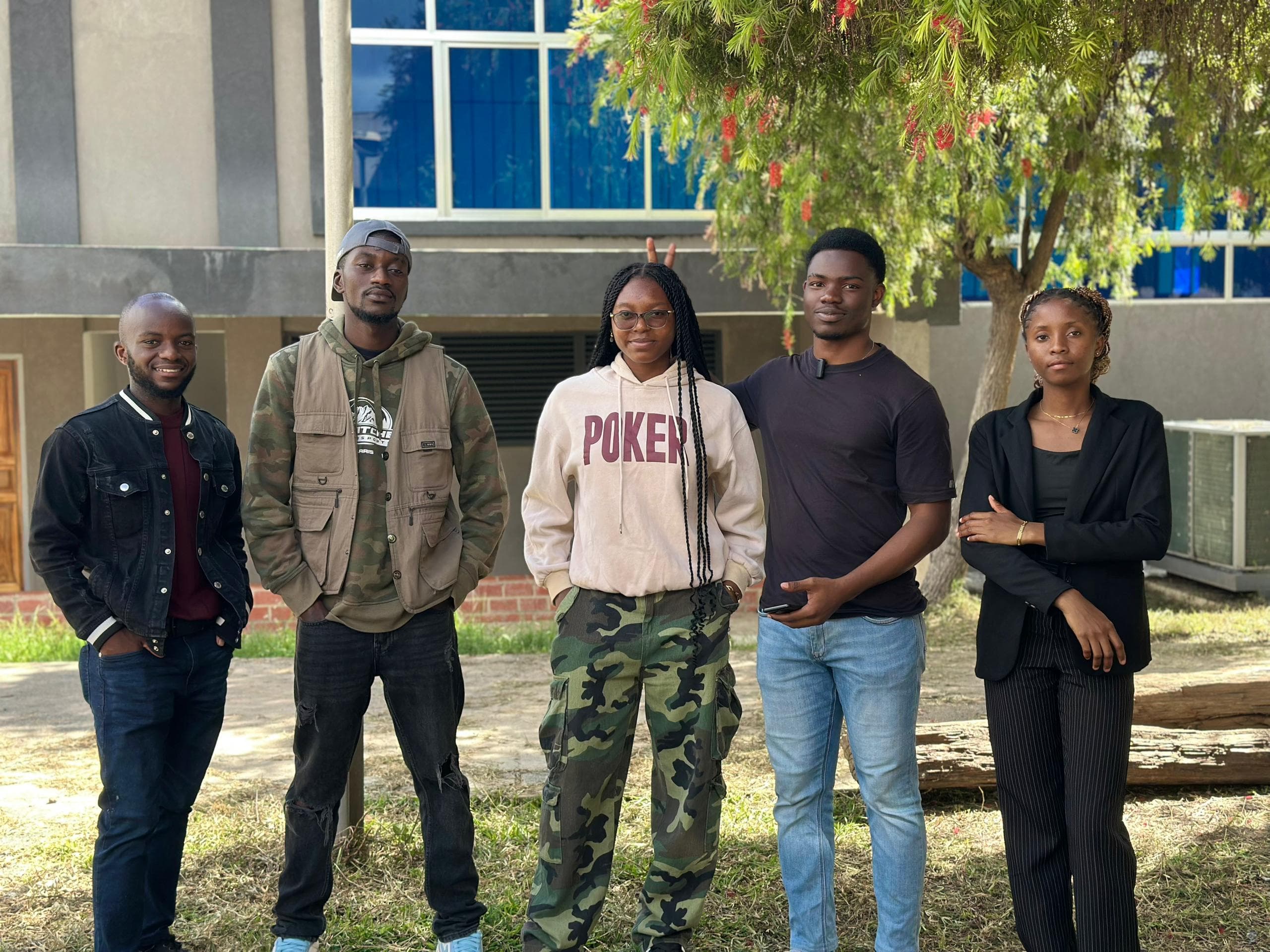 Joseph with a university engineering podcast team discussing AI in Zambia