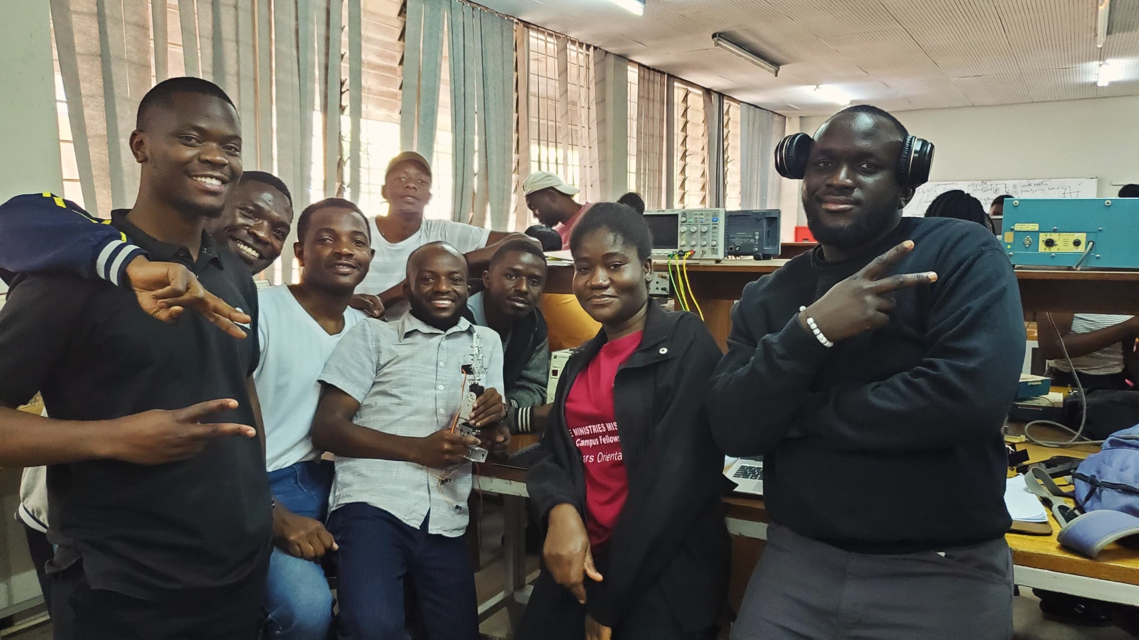 Joseph and coursemates programming Raspberry Pi microcontrollers in the lab